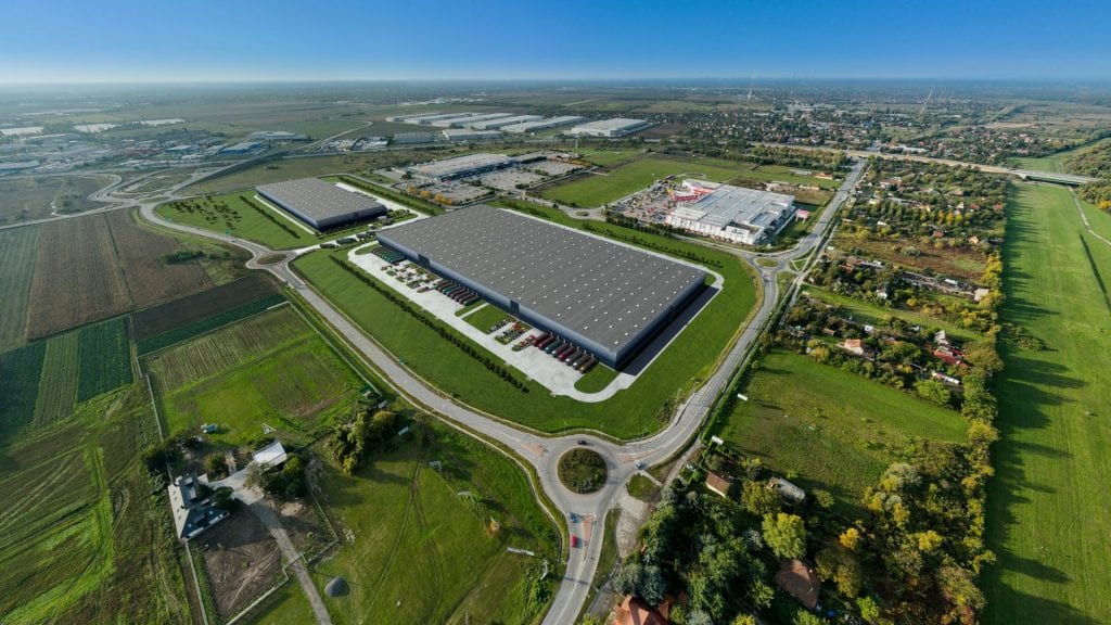 Drone view of a GLP warehouse surrounded by countryside.