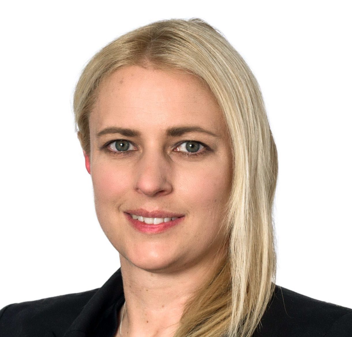 Headshot of Adrienne Howells, smiling, with blonde hair.