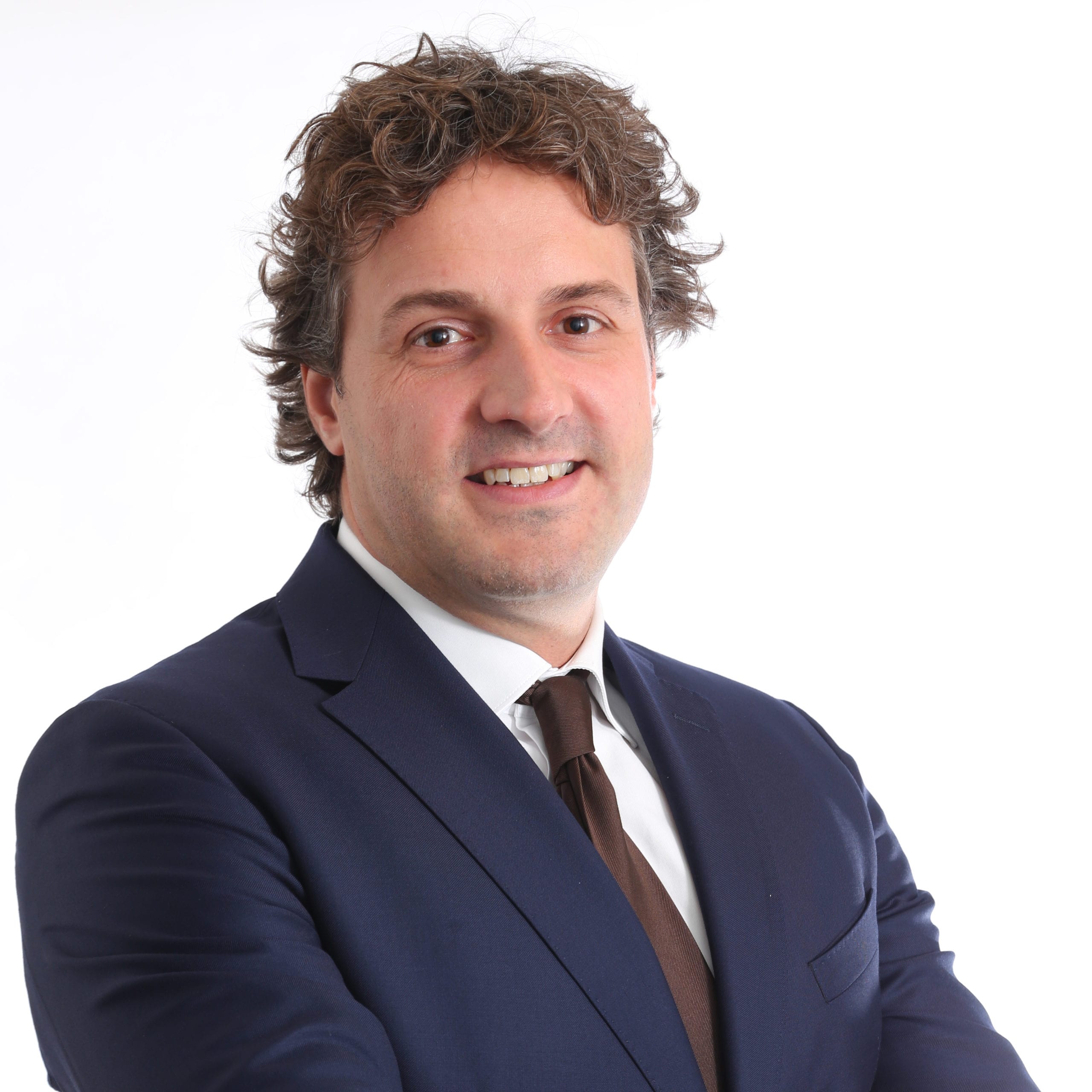 Headshot of Philippe Hendriks wearing a navy suit