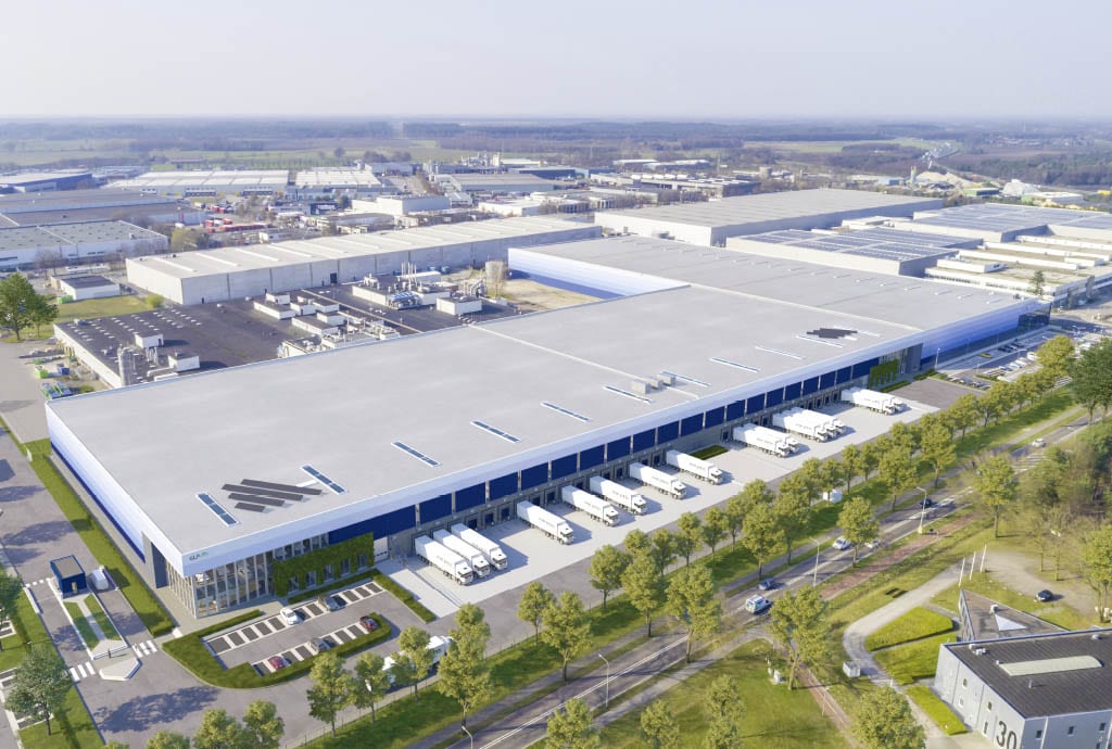 GLP logistics centre in Venray from a birds-eye point-of-view, showing surrounding industrial buildings and rows of trees.