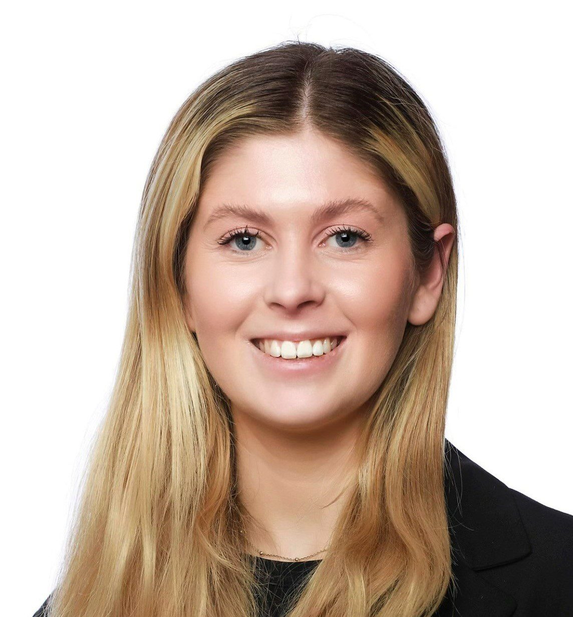 Headshot of Amy Young with blonde hair, smiling and wearing a black top and thin gold necklace