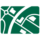 Side-on view of a GLP logistics centre showing light blue colour scheme and a series of loading bays with a town on the skyline.