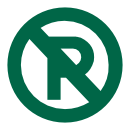 Flowers in a field next to a large warehouse