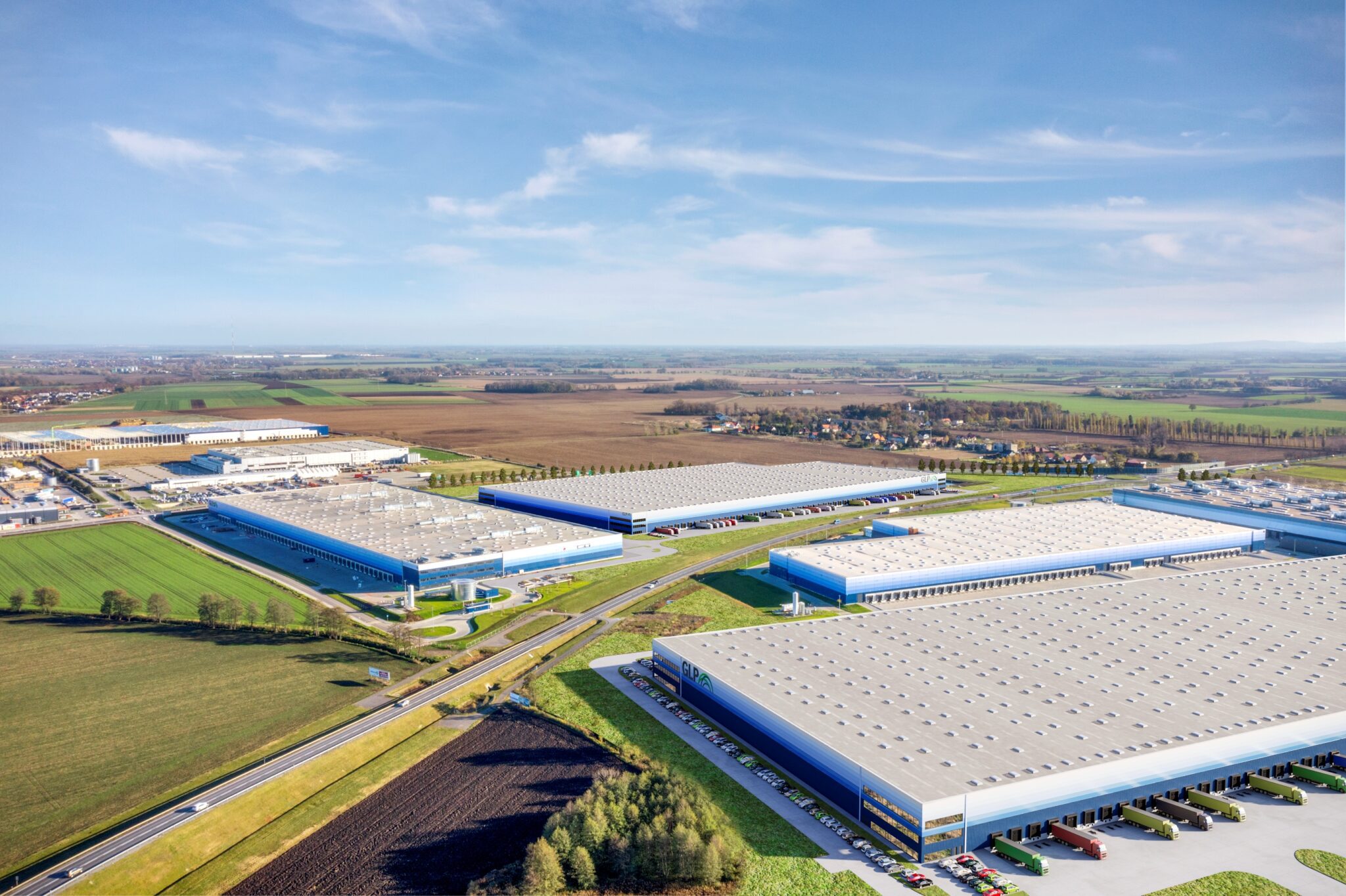 View of warehouses in Wroclaw, surrounded by countryside.
